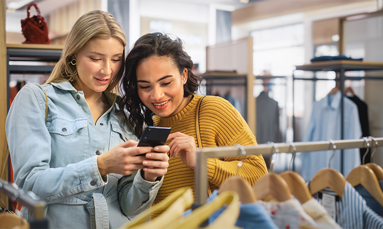 two girls shopping in mall for a blog about a 2025 wardrobe refresh